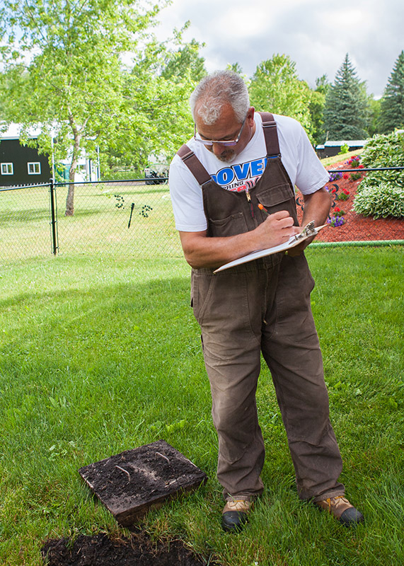 Guy inspecting septic tank